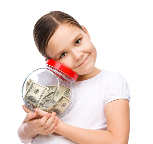 girl smiling with savings jar